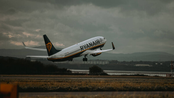 A Ryanair boeing 737 airplane taking off from the airport in Liverpool, United Kingdom