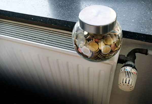 Closeup Jar Full Coins Heating Radiator — Stock Photo, Image