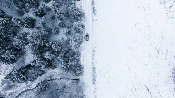 Drone Shot Car Driving Road Covered Snow Next Spruce Forest — Stock Photo, Image