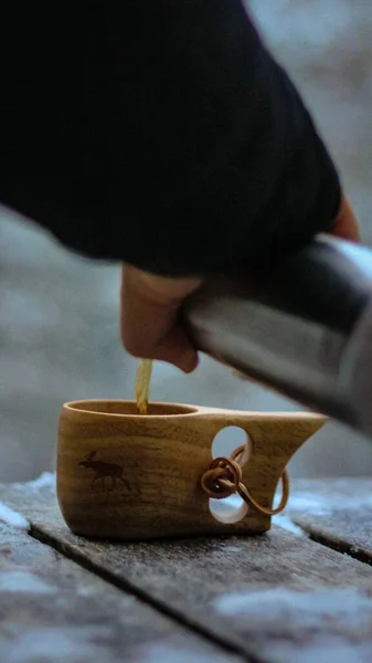 Man Pouring Tea Nordic Wooden Mug — Stock Photo, Image