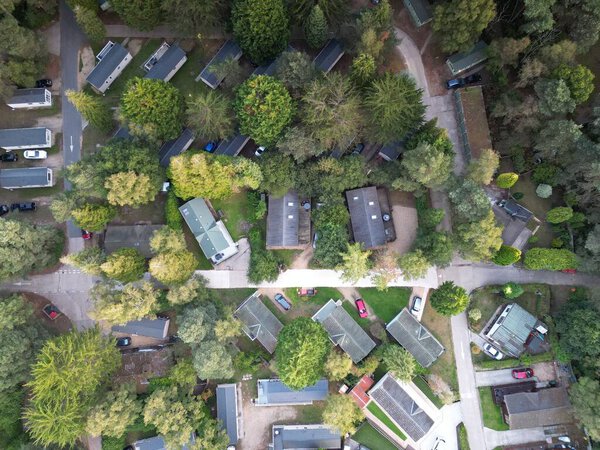 An aerial top view of buildings and trees in Southwest UK