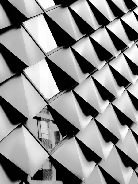 stock image A close up black and white shot of details of modern building with geometric shaped construction