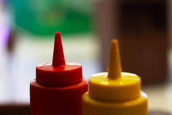 stock image A closeup of ketchup & mustard bottles