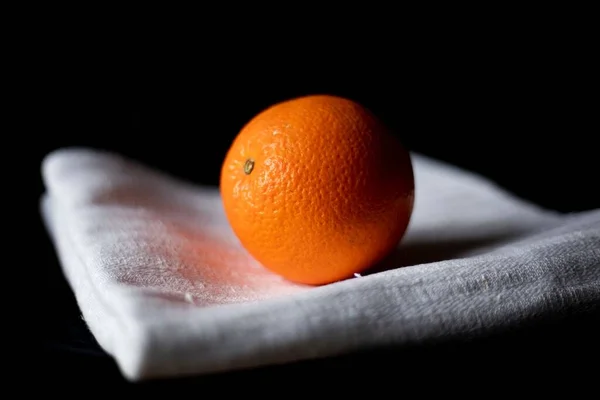 Closeup Shot Orange White Towel Isolated Black Background — Stock Photo, Image