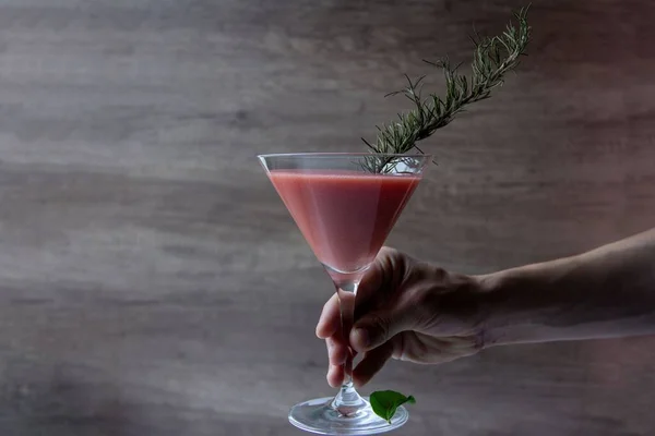 Horizontal Shot Hand Holding Cocktail Glass Pink Liquid Small Branch — Stock Photo, Image