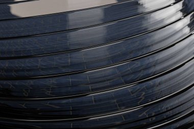 Koyu gri yuvarlak nesnelerin mavi arkaplanın açık renk yansıması olan bir görüntüsü.