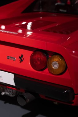 A closeup shot of the rear light of a red Ferrari 288 GTO 1984 at the Ferrari Museum clipart