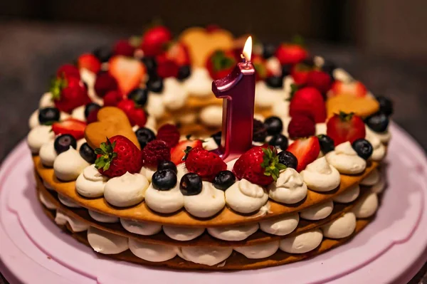 Closeup First Birthday Cake Decorated Strawberries Blueberries Lit Candle — Stock Photo, Image