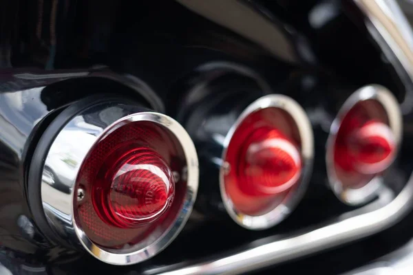 Closeup Shot Red Tail Lights Black Modern Car — Stock Photo, Image