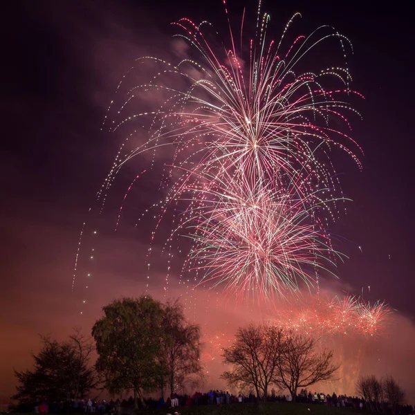 stock image A beautiful shot of exploding colorful fireworks in a night sky over Heaton Park