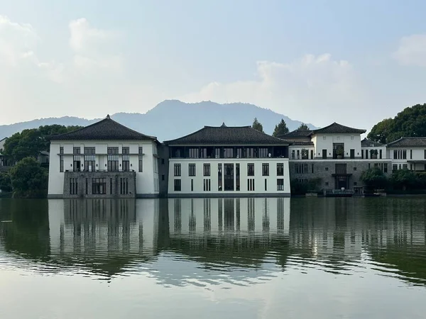 A golf hotel, a traditional Chinese architecture with a reflection on the lake