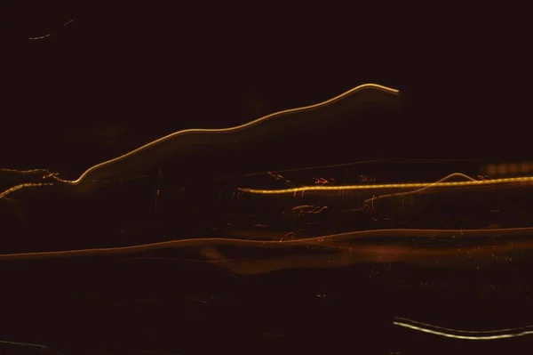 Karanlık Bir Arkaplanda Işıkların Uzun Pozlu Görüntüsü — Stok fotoğraf