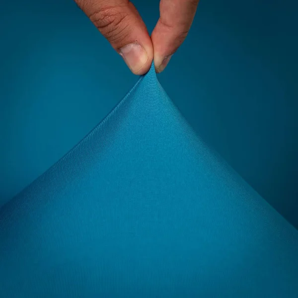 Colorful Stretching Textile Isolated Blue Background — Stock Photo, Image