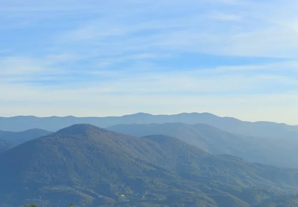 Stock image The hills with green lush trees against a blue sky in Sarajevo