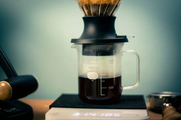 stock image The Hario V60 Immersion Dripper preparing coffee on the blurred background