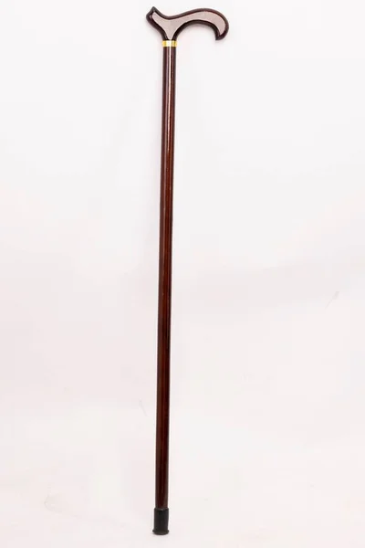 Tiro Vertical Uma Bengala Madeira Com Punho Curvo Isolado Fundo — Fotografia de Stock