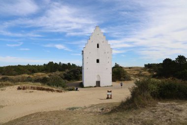 A view of the Den Tilsandede Kirke - a historical landmark in Skagen, Denmark clipart