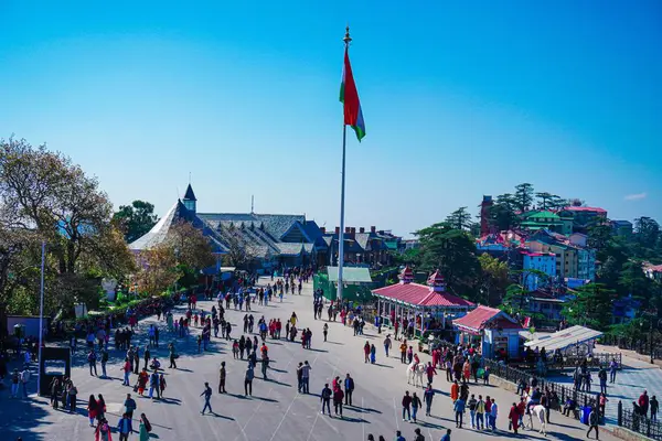 stock image A beautiful view of The Ridge Shimla and the people walking around the Indian flag