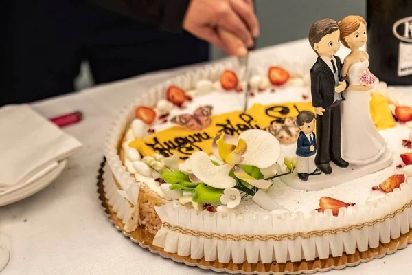 Wedding cake cut on restaurant table during dinner