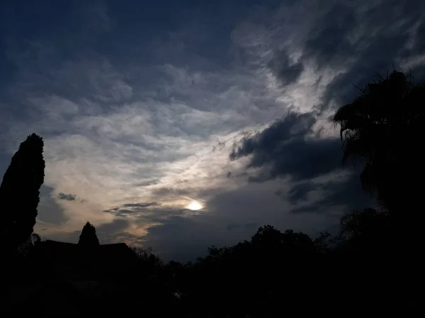 stock image A scenic shot of sun behind dark clouds at sunset in Africa