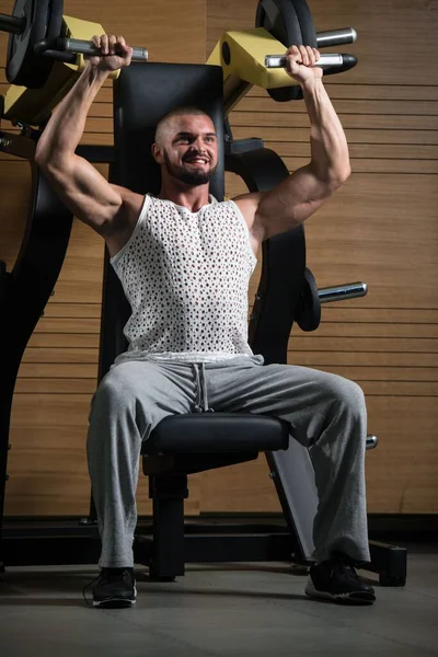 Handsome Muscular Fitness Bodybuilder Doing Heavy Weight Exercise Shoulders Machine — Stock Photo, Image