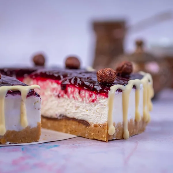 Closeup Piece Cheesecake Jam Surface Decorated Vanilla Cream Chocolate Balls — Stock Photo, Image