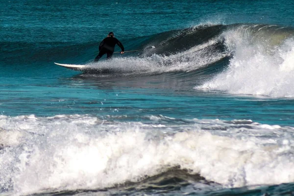 Scene Man Paddleboarding Sea Standing White Board Waves Daytime — Stock Photo, Image