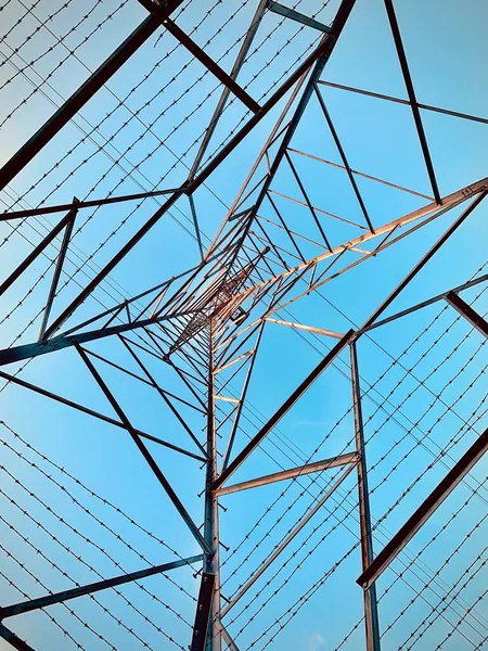 stock image A low angle of the Transmission tower or electricity pylon architecture with a blue sky background