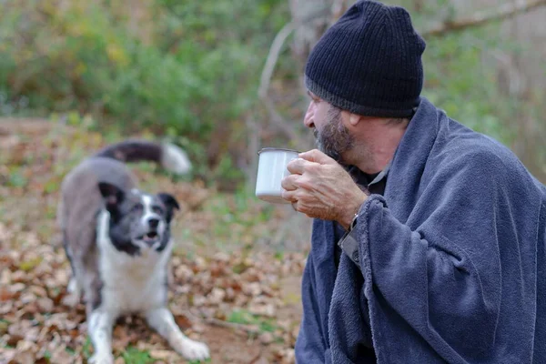 Bearded Man Covered Blanket Drinking Cup Coffee His Dog Background — Stock Photo, Image