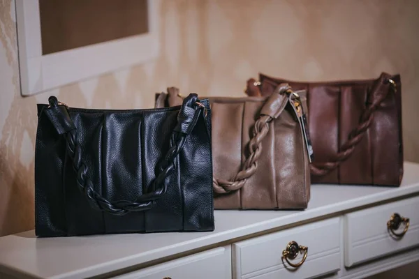 Three Elegant Leather Bags Top White Table — Stock Photo, Image