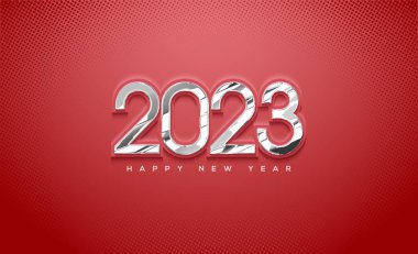 Kırmızı arka planda cam figürlerle 2023 yılınız kutlu olsun.