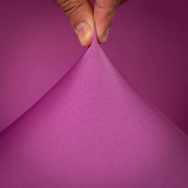 Colorido Estiramiento Textil Aislado Sobre Fondo Púrpura —  Fotos de Stock