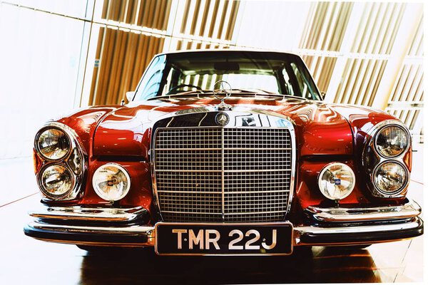 A luxury vintage red Mercedes Benz during exhibition in closeup