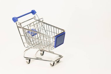 Shopping cart standing alone on white background