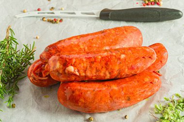 Fresh sausages garnished with herbs