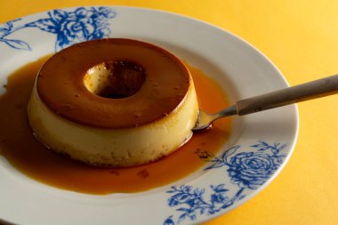 Serving delicious caramel flan dessert