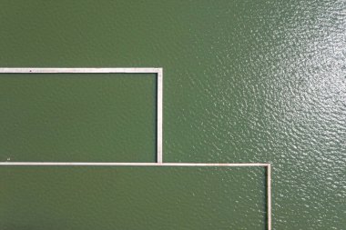 Beyaz dikdörtgen çerçeveli soyut yeşil duvar.