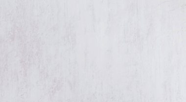 Textured surface showing subtle variations in light color