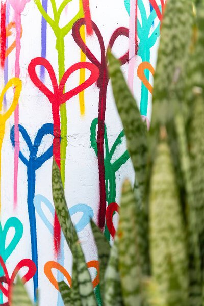 Colorful abstract design featuring various heart shapes on white background