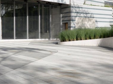 Modern architecture featuring glass walls and greenery