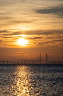 Connecting the Kingdoms: Golden Sunset Over the Iconic Oresund Strait