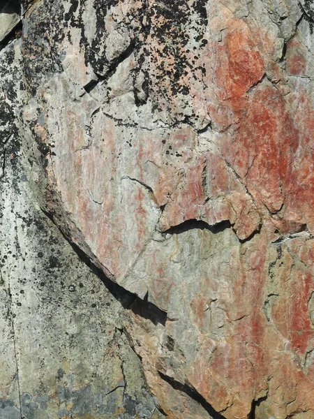 Prehistoric rock paintings with red paint