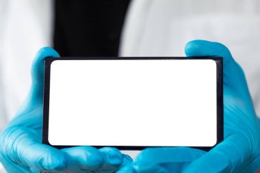 Unrecognizable doctor showing blank cell phone screen horizontally