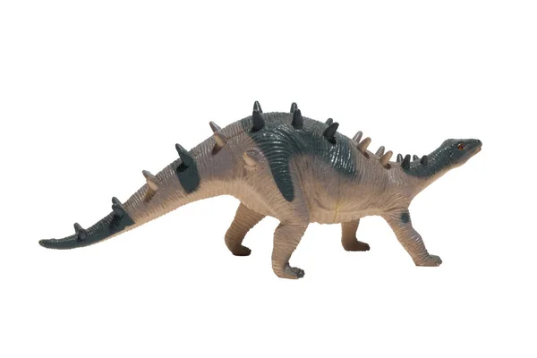 白い背景に背中にスパイクが付いた使い古された恐竜のおもちゃ ケントロサウルス — ストック写真