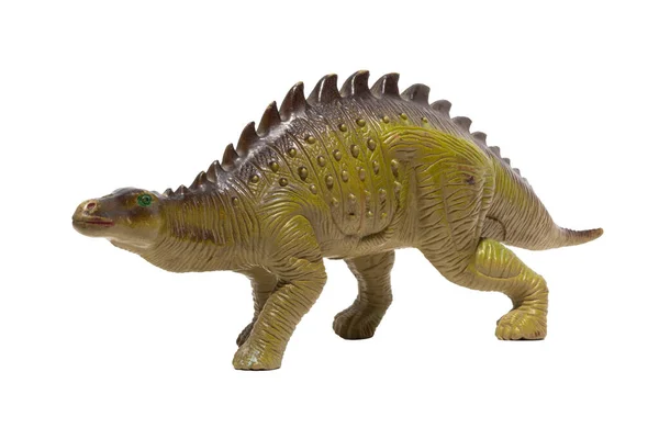 白い背景に隔離された背中にスパイクを持つプラスチック製の恐竜のおもちゃのクローズアップ — ストック写真