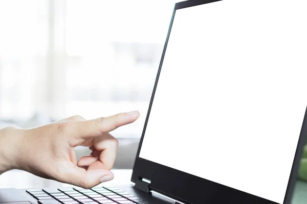 A person pointing at a blank laptop screen. Laptop screen mockup, template background. Online meeting concept.
