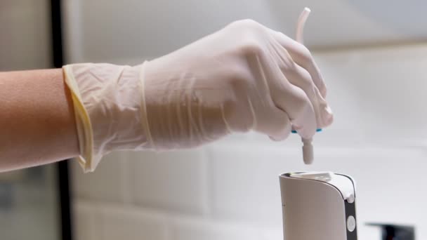 Dentist Hand Showing How Use Domestic Dental Water Flosser Deep — стоковое видео