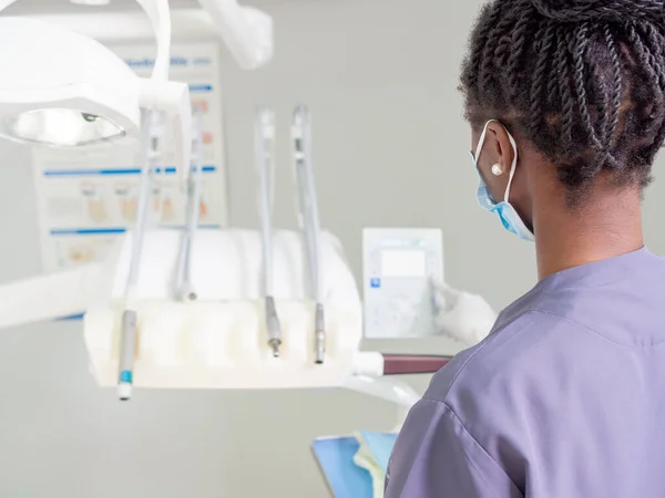 stock image Young female dentist Preparing materials before surgery