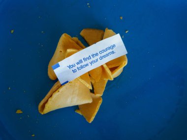 A fortune cookie positing that you will find the courage to follow your dreams