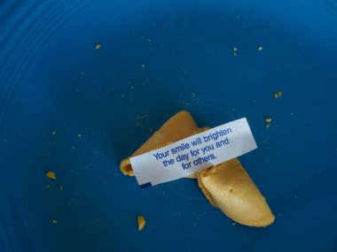 Fortune cookie posits that your smile will brighten the day.